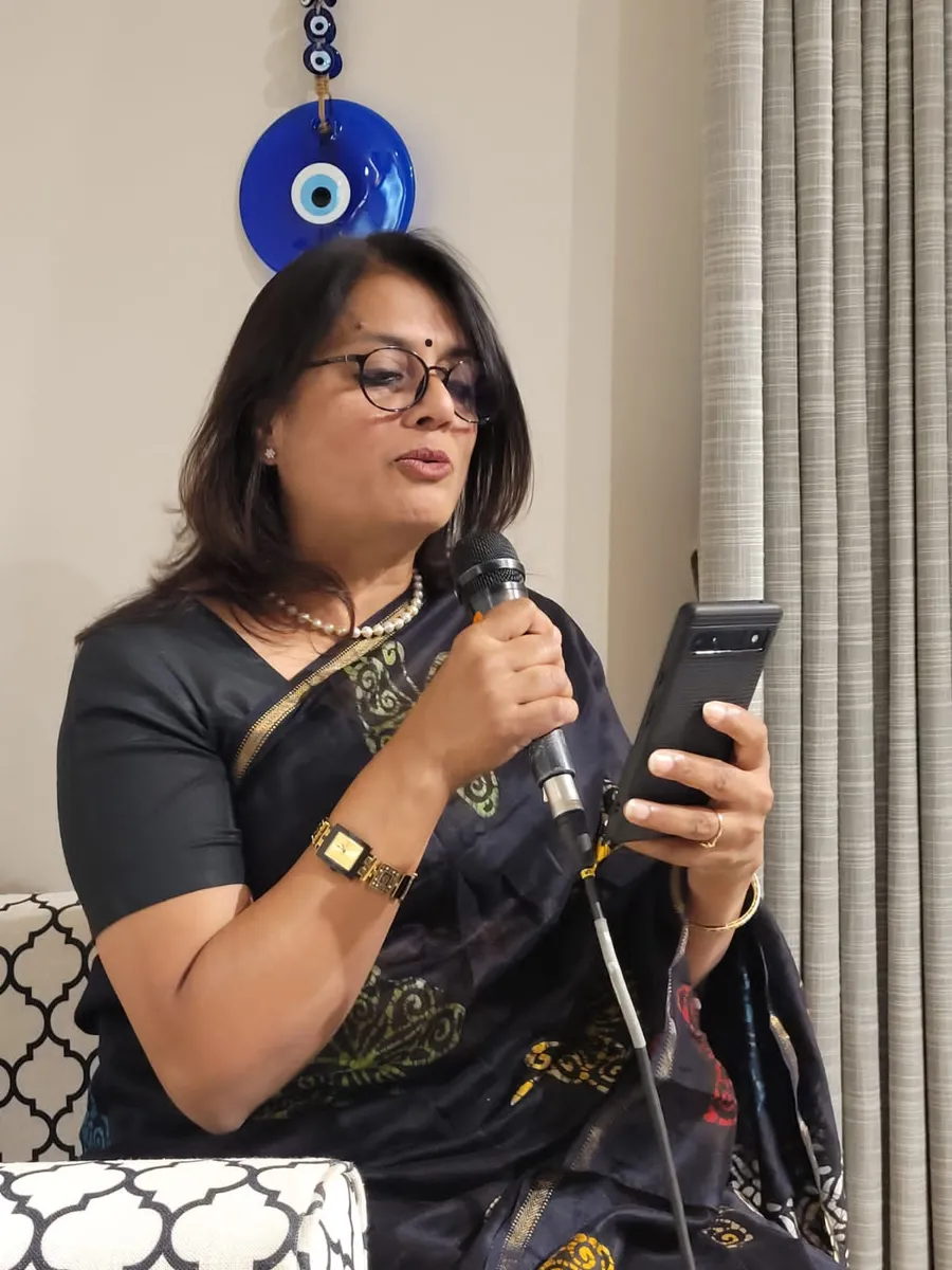 Jaya Sarkar lighting the ceremonial lamp at a literary symposium